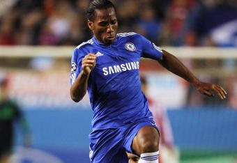 MADRID, SPAIN - NOVEMBER 03:  Didier Drogba   of Chelsea skips the tackle from Pablo Ibanez of Atletico Madrid during Champions League Group D match between Atletico Madrid and Chelsea at the Vicente Calderon Stadium on November 3, 2009 in Madrid, Spain.  (Photo by Shaun Botterill/Getty Images)