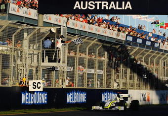 MELBOURNE, AUSTRALIA - MARCH 29:  Jenson Button of Great Britain and Brawn GP takes the chequered flag as he crosses the finish line to win the Australian Formula One Grand Prix at the Albert Park Circuit on March 29, 2009 in Melbourne, Australia.  (Photo by Robert Cianflone/Getty Images)