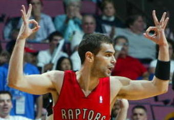 EAST RUTHERFORD, NJ - MAY 04:  Jose Calderon #8 of the Toronto Raptors reacts after a three pointer against the New Jersey Nets in Game Six of the Eastern Conference Quarterfinals during the 2007 NBA Playoffs on May 4, 2007 at the Continental Airlines Arena at the Meadowlands in East Rutherford, New Jersey. NOTE TO USER: User expressly acknowledges and agrees that, by downloading and or using this photograph, User is consenting to the terms and conditions of the Getty Images License Agreement.  (Photo by Jim McIsaac/Getty Images)