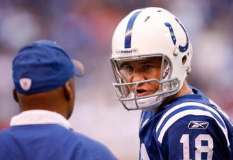 INDIANAPOLIS - NOVEMBER 01:  Peyton Manning #18 of the Indianapolis Colts talks with Head Coach Jim Caldwell during the NFL game against the San Francisco 49ers at Lucas Oil Stadium on November 1, 2009 in Indianapolis, Indiana.  (Photo by Andy Lyons/Getty Images)