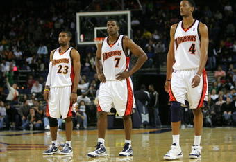 OAKLAND, CA - NOVEMBER 06:   C.J. Watson #23, Kelenna Azubuike #7 and Anthony Randolph #4 of the Golden State Warriors walk back on to the court after a time out late in their loss to the Los Angeles Clippers at Oracle Arena on November 6, 2009 in Oakland, California.  NOTE TO USER: User expressly acknowledges and agrees that, by downloading and/or using this Photograph, User is consenting to the terms and conditions of the Getty Images License Agreement.  (Photo by Ezra Shaw/Getty Images)