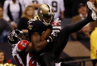NEW ORLEANS - NOVEMBER 2:  Marques Colston #12 of the New Orleans Saints catches a pass for a touchdown against Tye Hill #24 of the Atlanta Falcons during the second quarter of the game at the Louisiana Superdome on November 2, 2009 in New Orleans, Louisiana. (Photo by Chris Graythen/Getty Images)