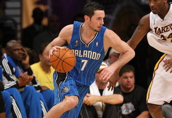 LOS ANGELES - JUNE 7:  J.J. Redick #7 of the Orlando Magic drives against Kobe Bryant #24 of the Los Angeles Lakers in Game Two of the 2009 NBA Finals at Staples Center on June 7, 2009 in Los Angeles, California.  The Lakers won 101-96 in overtime.  NOTE TO USER: User expressly acknowledges and agrees that, by downloading and or using this photograph, User is consenting to the terms and conditions of the Getty Images License Agreement.  (Photo by Stephen Dunn/Getty Images) 