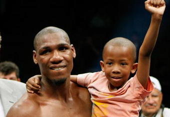 LAS VEGAS - APRIL 11:  Paul Williams holds his son Paul Williams Jr. as he celebrates defeating Winky Wright in a unanimous decision in their middleweight bout at the Mandalay Bay Events Center April 11, 2009 in Las Vegas, Nevada.  (Photo by Ethan Miller/Getty Images)