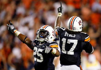 AUBURN, AL - SEPTEMBER 19:  Daren Bates #25 and Josh Bynes #17 of the Auburn Tigers celebrate Bynes interception in the final minutes of their 41-30 win over the West Virginia Mountaineers at Jordan-Hare Stadium on September 19, 2009 in Auburn, Alabama.  (Photo by Kevin C. Cox/Getty Images)