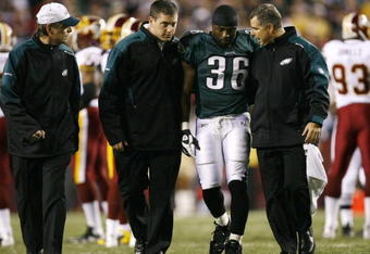 LANDOVER, MD - OCTOBER 26:  Brian Westbrook #36 of the Philadelphia Eagles is escorted off the field after getting hit during the first quarter of the game against the Washington Redskins at FedEx Field October 26, 2009 in Landover, Maryland. (Photo by Win McNamee/Getty Images)