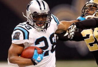 NEW ORLEANS - DECEMBER 28: Jonathan Stewart #28 of the Carolina Panthers is pushed out of bounds by Randall Gay #20 of the New Orleans Saints on December 28, 2008 at the Superdome in New Orleans, Louisiana. The Panthers defated the Saints 33-31.  (Photo by Chris Graythen/Getty Images)