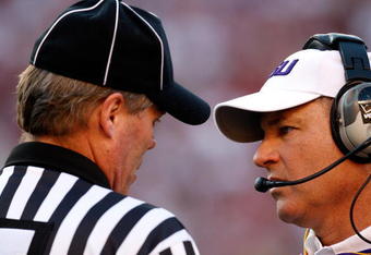 TUSCALOOSA, AL - NOVEMBER 07:  Head coach Les Miles of the Louisiana State University Tigers questions Head Linesman Johnny Crawford (L) during the game against the Alabama Crimson Tide at Bryant-Denny Stadium on November 7, 2009 in Tuscaloosa, Alabama.  (Photo by Kevin C. Cox/Getty Images)