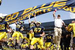 ANN ARBOR, MI - SEPTEMBER 05:  Head coach Rich Rodriguez enters the stadium with his team prior to playing the Western Michigan Broncos on September 5, 2009 at Michigan Stadium in Ann Arbor, Michigan.  (Photo by Gregory Shamus/Getty Images)