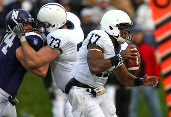 EVANSTON, IL - OCTOBER 31: Daryll Clark #17 of the Penn State Nittany Lions runs with the ball as teammate Dennis Landolt #73 blocks Vince Browne #94 of the Northwestern Wildcats at Ryan Field on October 31, 2009 in Evanston, Illinois. Penn State defeated Northwestern 34-13. (Photo by Jonathan Daniel/Getty Images)