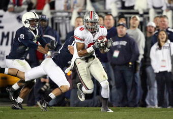 STATE COLLEGE, PA - NOVEMBER 7: Wide receiver DeVier Posey #8 of the Ohio State Buckeyes catches a 62 yard touchdown pass during a game against the Penn State Nittany Lions on November 7, 2009 at Beaver Stadium in State College, Pennsylvania. Ohio State won 24-7. (Photo by Hunter Martin/Getty Images)