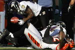 CINCINNATI - NOVEMBER 8:  Ed Reed # 20 of the Baltimore Ravens fumbles the football after be hit by Adbul Hodge #52 of the Cincinnati Bengals at Paul Brown Stadium on November 8, 2009 in Cincinnati, Ohio.  (Photo by John Sommers II/Getty Images)