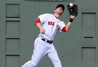 BOSTON - OCTOBER 11:  Jason Bay #44 of the Boston Red Sox catches a Torii Hunter #48 of the Los Angeles Angels of Anaheim fly ball in the third inning of Game Three of the ALDS during the 2009 MLB Playoffs at Fenway Park on October 11, 2009 in Boston,  Massachusetts. (Photo by Jim Rogash/Getty Images)