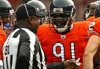 CHICAGO - NOVEMBER 01: Tommie Harris #91 of the Chicago Bears jokes with umpire Roy Ellison #81 during a game against the Cleveland Browns at Soldier Field on November 1, 2009 in Chicago, Illinois. The Bears defeated the Browns 30-6. (Photo by Jonathan Daniel/Getty Images)