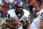SAN DIEGO - NOVEMBER 07:  Running back Matthew Tucker #29 of the Texas Christian University Horned Frogs carries the ball at the start of a 30 yard touchdown run in the third quarter against the San Diego State Aztecs on November 7, 2009 at Qualcomm Stadium in San Diego, California.   TCU won 55-12.  (Photo by Stephen Dunn/Getty Images)