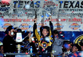 FORT WORTH, TX - NOVEMBER 08:  Kurt Busch, driver of the #2 Miller Lite Dodge, celebrates by firing two Beretta's into the air on victory lane after winning the NASCAR Sprint Cup Series Dickies 500 at Texas Motor Speedway on November 8, 2009 in Fort Worth, Texas.  (Photo by Rusty Jarrett/Getty Images for NASCAR)