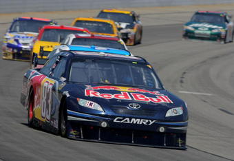LONG POND, PA - AUGUST 03:  Brian Vickers, driver of the #83 Red Bull Toyota, races to a sixth place finish in the NASCAR Sprint Cup Series Sunoco Red Cross Pennsylvania 500 at the Pocono Raceway on August 3, 2009 in Long Pond, Pennsylvania.  (Photo by Doug Pensinger/Getty Images)