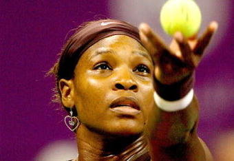 DOHA, QATAR - NOVEMBER 01:  Serena Williams of the United States serves to Venus Williams of the United States during the final of the Sony Ericsson WTA Championships at the Khalifa International Tennis and Squash Complex on November 1, 2009 in Doha, Qatar.  (Photo by Matthew Stockman/Getty Images)