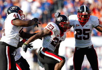JACKSONVILLE, FL - OCTOBER 31:  The Georgia Bulldogs defense celebrates against the Florida Gators at Jacksonville Municipal Stadium on October 31, 2009 in Jacksonville, Florida.  (Photo by Kevin C. Cox/Getty Images)