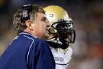 ATLANTA - OCTOBER 17:  Head coach Paul Johnson (L) of the Georgia Tech Yellow Jackets converses with quarterback Josh Nesbitt #9 after his touchdown against the Virginia Tech Hokies at Bobby Dodd Stadium on October 17, 2009 in Atlanta, Georgia.  (Photo by Kevin C. Cox/Getty Images)