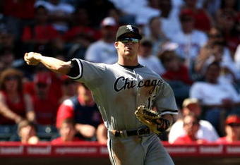 ANAHEIM, CA - SEPTEMBER 12: Third baseman Gordon Beckham #15 the Chicago White Sox throws out Torii Hunter of the Los Angeles Angels of Anaheim on a bunt in the sixth inning on September 12, 2009 at Angel Stadium in Anaheim, California.  The White Sox won 4-3 in 10 innings.  (Photo by Stephen Dunn/Getty Images)