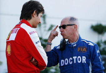 BUDAPEST, HUNGARY - JULY 25:  F.I.A. doctor Gary Hartstein talks with a Ferrari team member following qualifying for the Hungarian Formula One Grand Prix at the Hungaroring on July 25, 2009 in Budapest, Hungary.  (Photo by Paul Gilham/Getty Images)