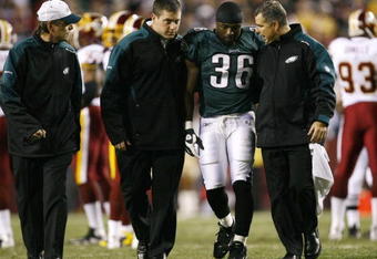 LANDOVER, MD - OCTOBER 26:  Brian Westbrook #36 of the Philadelphia Eagles is escorted off the field after getting hit during the first quarter of the game against the Washington Redskins at FedEx Field October 26, 2009 in Landover, Maryland. (Photo by Win McNamee/Getty Images)