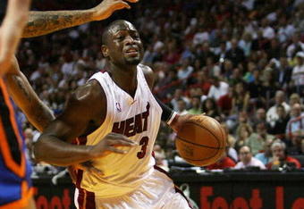 MIAMI - OCTOBER 28:  Dwyane Wade #3 of the Miami Heat drives to the basket while taking on the New York Knicks at AmericanAirlines Arena on October 28, 2009 in Miami, Florida. NOTE TO USER: User expressly acknowledges and agrees that, by downloading and/or using this Photograph, user is consenting to the terms and conditions of the Getty Images License Agreement.  (Photo by Doug Benc/Getty Images)