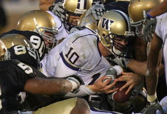 SOUTH BEND, IN - OCTOBER 03: Members of the Notre Dame Fighting Irish defense stop Jake Locker #10 of the Washington Huskies on third down at the goal line in the 4th quarter on October 3, 2009 at Notre Dame Stadium in South Bend, Indiana. Notre Dame defeated Washington 37-30 in overtime. (Photo by Jonathan Daniel/Getty Images)