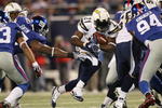 EAST RUTHERFORD, NJ - NOVEMBER 08:  LaDainian Tomlinson #21 of the San Diego Chargers rushes against the New York Giants at Giants Stadium on November 8, 2009 in East Rutherford, New Jersey.  (Photo by Nick Laham/Getty Images)