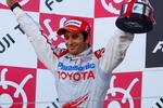 SUZUKA, JAPAN - OCTOBER 04:  Jarno Trulli of Italy and Toyota celebrates on the podium after finishing second during the Japanese Formula One Grand Prix at Suzuka Circuit on October 4, 2009 in Suzuka, Japan.  (Photo by Mark Thompson/Getty Images)