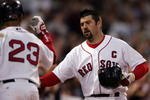BOSTON - MAY 29:  Jason Varitek #33 of the Boston Red Sox is congratulated by teammate Julio Lugo #23 after Varitek hit a solo home run in the fifth inning against the Cleveland Indians at Fenway Park May 29, 2007 in Boston, Massachusetts.  (Photo by Elsa/Getty Images)
