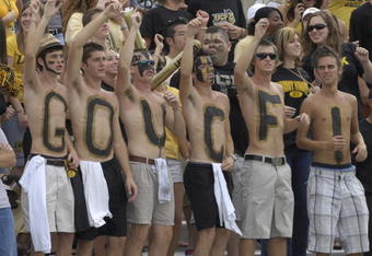 ORLANDO, FL - OCTOBER 20: Fans of the University of Central Florida Golden Knights cheer play against the Tulsa Golden Hurricane at Bright House Stadium on October 20, 2007 in Orlando, Florida.  UCF won 44 - 23. (Photo by Al Messerschmidt/Getty Images)