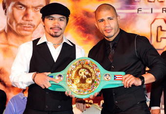 BEVERLY HILLS, CA - SEPTEMBER 14:  Manny Pacquiao and  Miguel Cotto pose for pictures during the press conference at the Beverly Hills Hotel on September 14, 2009 in Beverly Hills, California.  (Photo by Jacob de Golish/Getty Images)