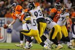 DENVER - NOVEMBER 09: Kyle Orton #8 of the Denver Broncos tries to get rid of the ball as he is pressured by the Pittsburgh Steelers at Invesco Field at Mile High on November 09, 2009 in Denver, Colorado. (Photo by Doug Pensinger/Getty Images)