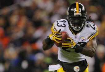 DENVER - NOVEMBER 09: Tyrone Carter #23 of the Pittsburgh Steelers runs for a touchdown after making an interception in the second quarter against the Denver Broncos at Invesco Field at Mile High on November 09, 2009 in Denver, Colorado. (Photo by Doug Pensinger/Getty Images)