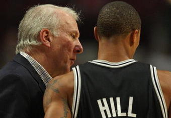 CHICAGO - OCTOBER 29: Head coach Gregg Popovich of the San Antonio Spurs talks with George Hill #3 during a game against the Chicago Bulls at the United Center on October 29, 2009 in Chicago, Illinois. The Bulls defeated the Spurs 92-85. (Photo by Jonathan Daniel/Getty Images)