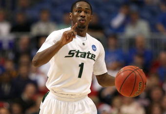 MINNEAPOLIS - MARCH 22:  Kalin Lucas #1 of the Michigan State Spartans gestures as he brings the ball up court against the USC Trojans during the second round of the NCAA Division I Men's Basketball Tournament at the Hubert H. Humphrey Metrodome on March 22, 2009 in Minneapolis, Minnesota.  (Photo by Jonathan Daniel/Getty Images)