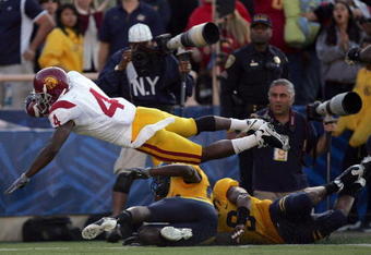BERKELEY, CA - OCTOBER 03:  Joe McKnight #4 of the USC Trojans dives in to the endzone for a touchdown during their game against the California Golden Bears at California Memorial Stadium on October 3, 2009 in Berkeley, California.  (Photo by Ezra Shaw/Getty Images)
