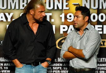LAS VEGAS - SEPTEMBER 18:  WWE wrestler Triple H (L) and boxing promoter Oscar De La Hoya talk during the official weigh-in for boxers Floyd Mayweather Jr. and Juan Manuel Marquez at the MGM Grand Garden Arena September 18, 2009 in Las Vegas, Nevada. The two will fight at the MGM on September 19.  (Photo by Ethan Miller/Getty Images)