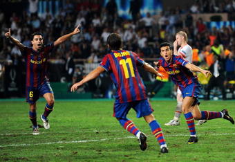 MONACO - AUGUST 28: Pedro Rodriguez (R) of Barcelona celebrates scoring the winning goal with team mates Xavi Hernandez (L) and Bojan Krkic during the UEFA Super Cup Final between FC Barcelona and Shakhtar Donetsk at The Stade Louis II Stadium on August 28, 2009 in Monaco, Monaco.  (Photo by Laurence Griffiths/Getty Images)