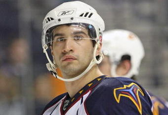 NASHVILLE, TN - SEPTEMBER 17: Center Angelo Esposito #57 of the Atlanta Thrashers skates during an NHL pre-season game at the Sommet Center on September 17, 2009 in Nashville, Tennessee.  (Photo by Frederick Breedon/Getty Images)
