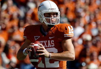 DALLAS - OCTOBER 17:  Quarterback Colt McCoy #12 of the Texas Longhorns drops back to pass against the Oklahoma Sooners at Cotton Bowl on October 17, 2009 in Dallas, Texas.  (Photo by Ronald Martinez/Getty Images)
