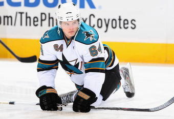 GLENDALE, AZ - SEPTEMBER 26:  Jamie McGinn #64  of the San Jose Sharks warms up before the preseason NHL game against the Phoenix Coyotes at Jobing.com Arena on September 26, 2009 in Glendale, Arizona.  The Coyotes defeated the Sharks 2-0.  (Photo by Christian Petersen/Getty Images)
