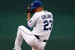KANSAS CITY, MO - JUNE 17:  Zack Greinke #23 of the Kansas City Royals pitches against the Arizona Diamondbacks during the game on June 17, 2009 at Kauffman Stadium in Kansas City, Missouri. (Photo by Jamie Squire/Getty Images)