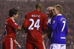 LIVERPOOL, ENGLAND - NOVEMBER 09:  David Ngog of Liverpool is confronted by Lee Carsley of Birmingham City after he won his side a penalty kick during the Barclays Premier League match between Liverpool and Birmingham City at Anfield on November 9, 2009 in Liverpool, England.  (Photo by Alex Livesey/Getty Images)