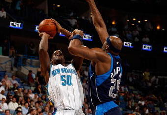 NEW ORLEANS - NOVEMBER 04:  Emeka Okafor #50 of the New Orleans Hornets makes a shot over Erick Dampier #25 of the  Dallas Mavericks at New Orleans Arena on November 4, 2009 in New Orleans, Louisiana.  The Hornets defeated the Mavericks 114-107.  NOTE TO USER: User expressly acknowledges and agrees that, by downloading and or using this photograph, User is consenting to the terms and conditions of the Getty Images License Agreement.  (Photo by Chris Graythen/Getty Images)