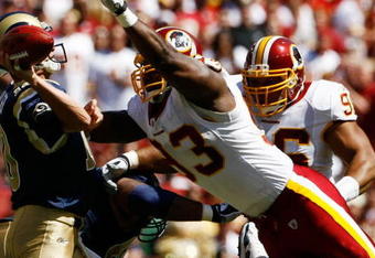 LANDOVER, MD - SEPTEMBER 20:  Mark Bulger #10 of the St. Louis Rams tries to avoid Phillip Daniels #92 of the Washington Redskins during their game on September 20, 2009 at FedEx Field in Landover, Maryland. (Photo by Win McNamee/Getty Images)