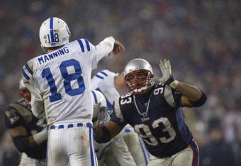 FOXBORO, MA - JANUARY 18:  Quarterback Peyton #18 of the Indianapolis Colts passes the ball over defensive end Richard Seymour #93 of the New England Patriots during the AFC Championship Game at Gillette Stadium on January 18, 2004 in Foxboro, Massachusetts. The Patriots defeated the Colts 24-14. (Photo by Ezra Shaw/Getty Images)