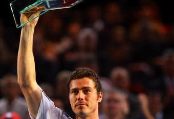 PARIS - NOVEMBER 11:  Marit Safin of Russia holds aloft his award after playing his final competitive match against Juan Martin Del Potro of Argentina during the ATP Masters Series at the Palais Omnisports De Paris-Bercy on November 11, 2009 in Paris, France.  (Photo by Clive Rose/Getty Images)